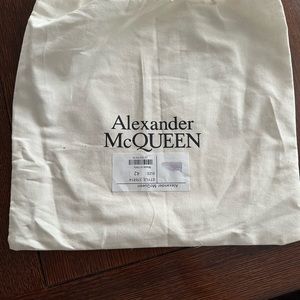 Brand new Alexander McQueen Men’s sneakers white on white.  Size 42